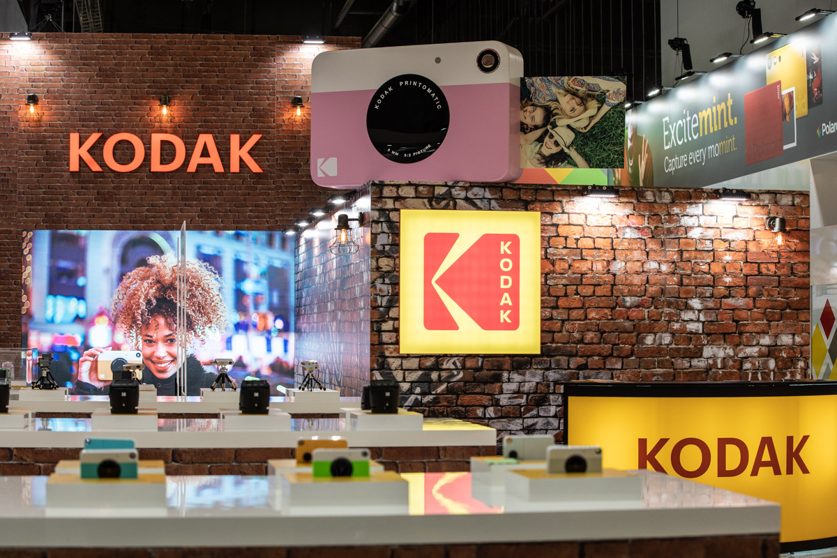 Kodak at IFA Berlin 2018 — Branding Front view of Kodak branding, camera displays and a large instant-camera model at IFA Berlin 2018