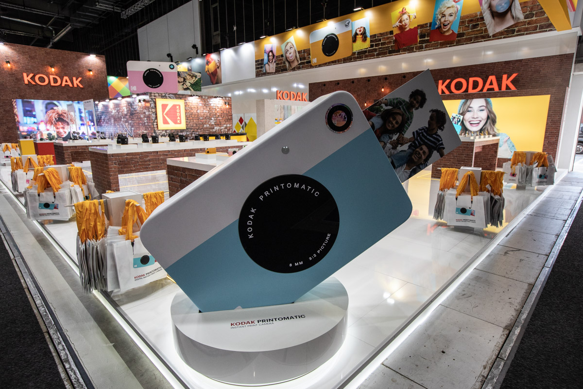 Kodak at IFA Berlin 2018 — Product presentation Oversized instant-camera model in front of the Kodak product display at IFA Berlin 2018