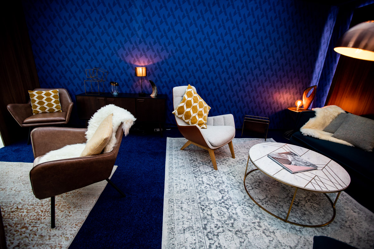 Accor at IHIF Berlin 2021 — Stand interior Wide view of lounge seating, tables and lighting in the Accor exhibition interior at IHIF Berlin 2021